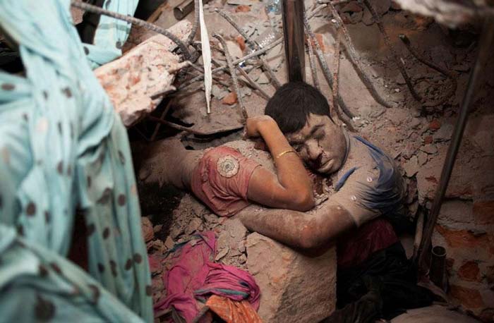 16. Embracing couple in the rubble of a collapsed factory